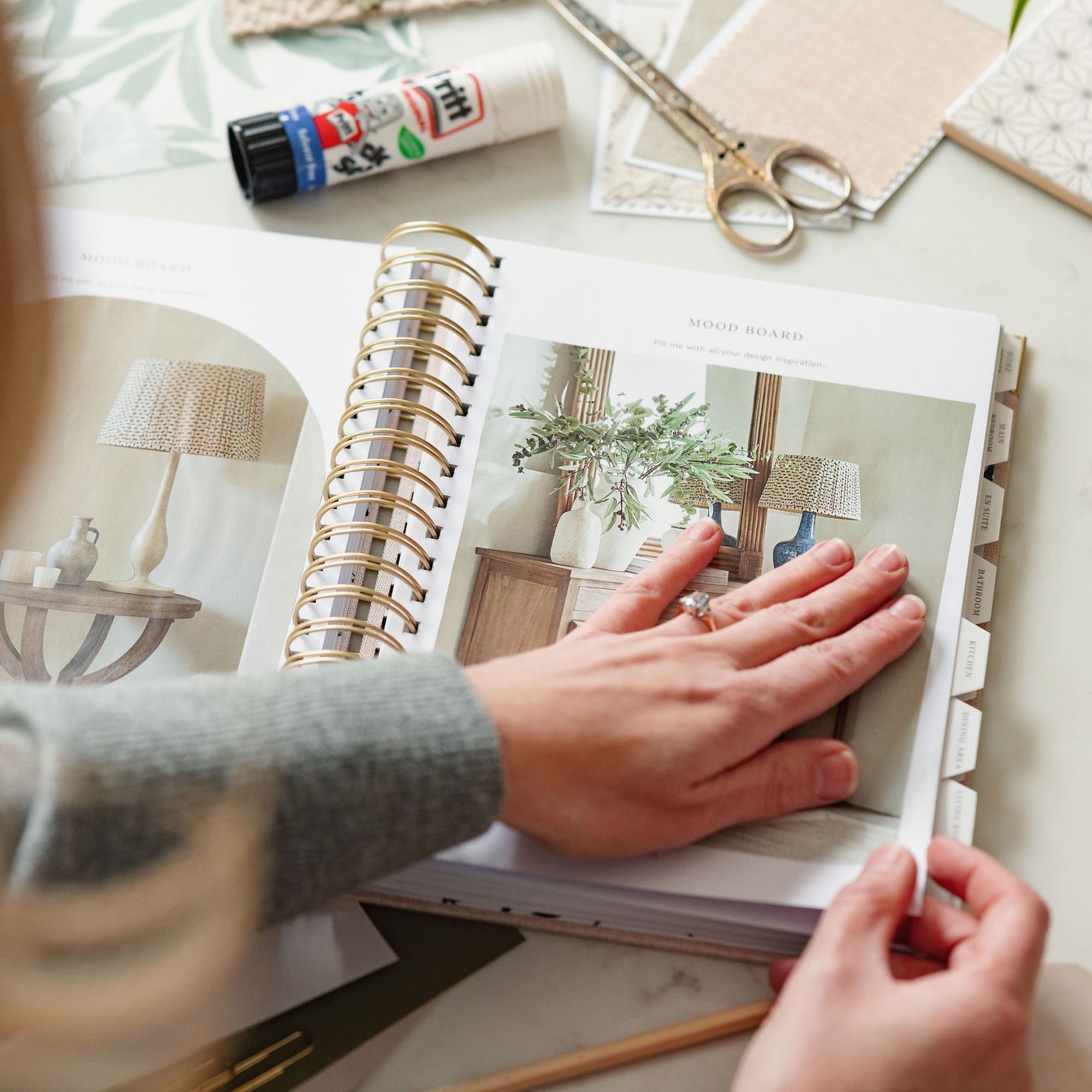 home planner sticking in inspiration images for interior design